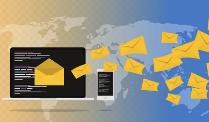 Laptop and phone sending emails across a world map—global email marketing outreach